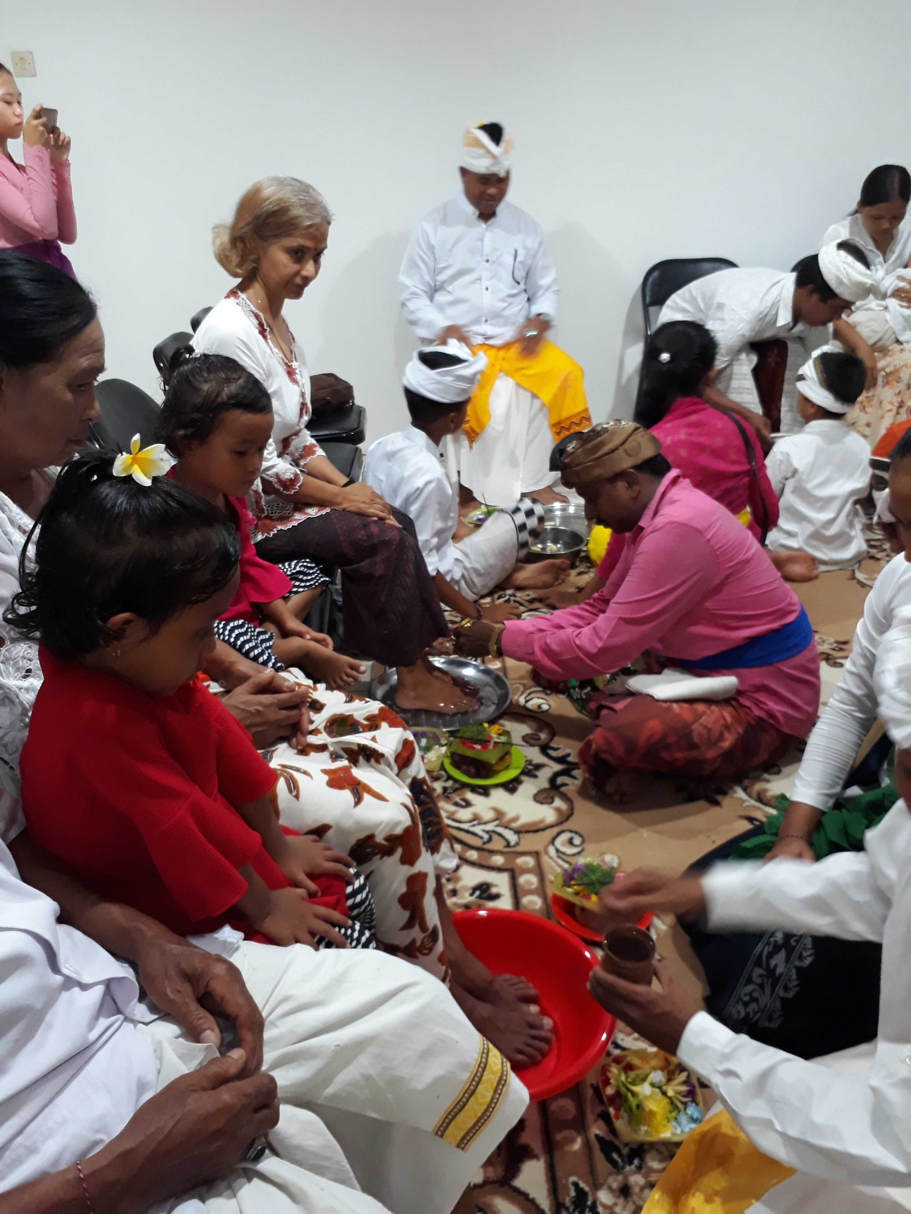 washing the feet of parents